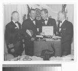 Preston Foster and three men at a U.S. Coast Guard award ceremony